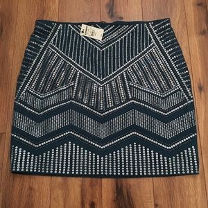 Teal short skirt with silver details